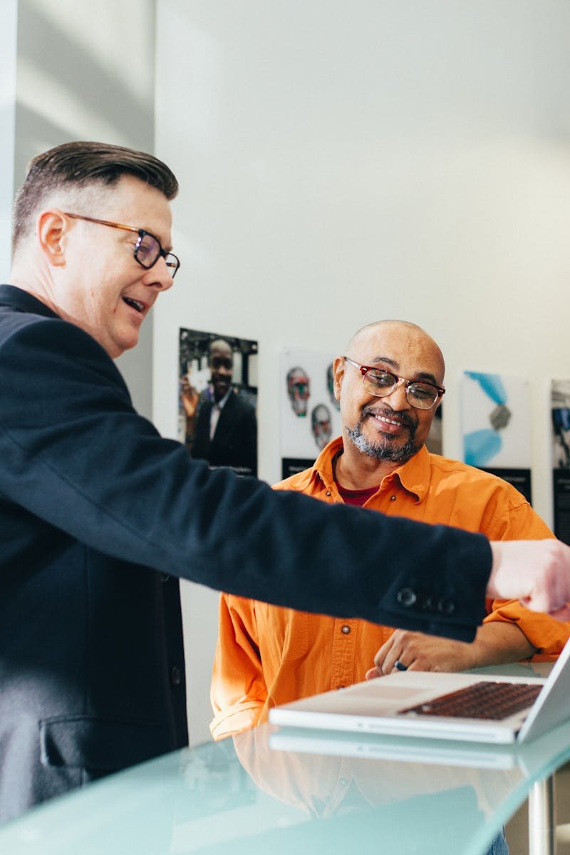 Man Pointing Laptop Computer